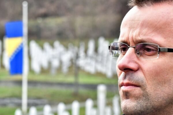 He survived a mass execution at 17. Now he’s fighting disinformation and denialism.